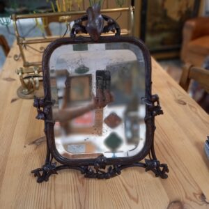 Miroir XIXème cadre en bois sculpté, glace biseautée